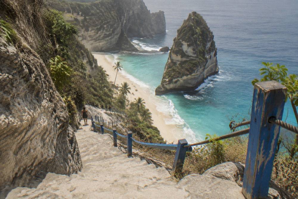 The steep carved cliff staircase descending toward Diamond Beach on Nusa Penida