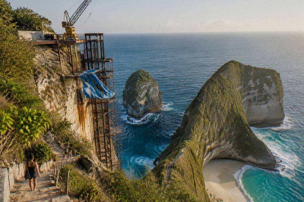 Half-built lift structure on a cliff face above the ocean