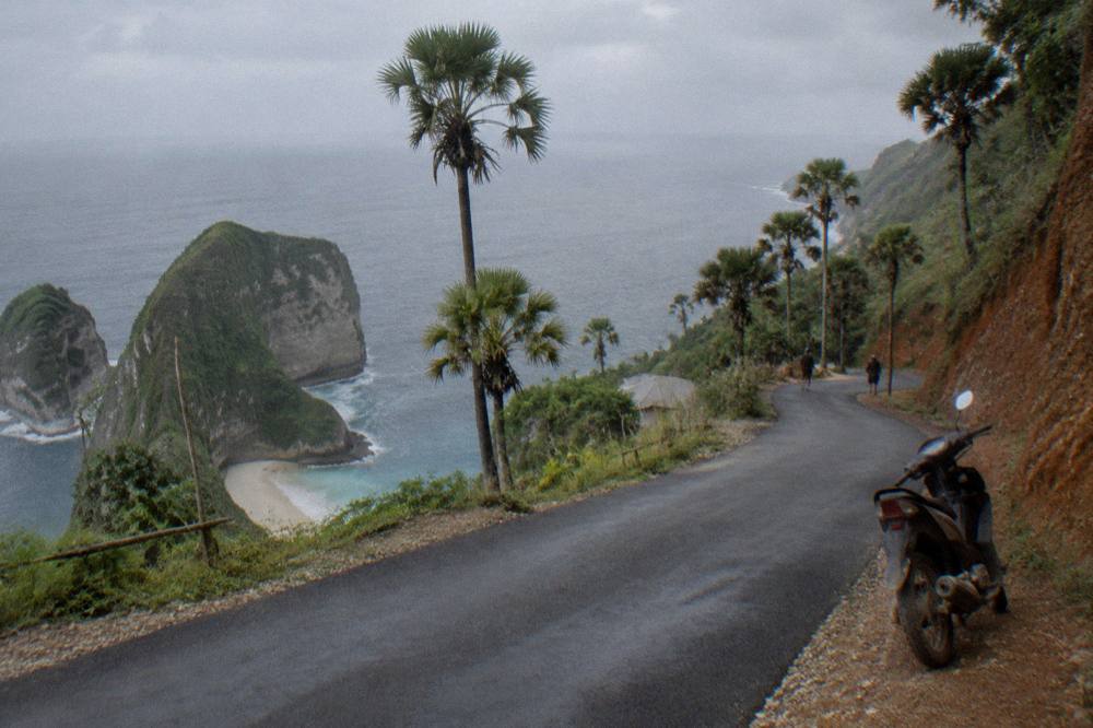 Coastal road winding along clifftops above the ocean
