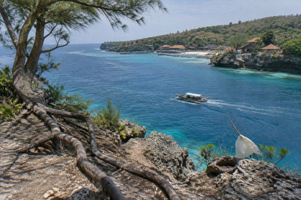 Turquoise channel between Nusa Penida and Nusa Lembongan seen from a clifftop